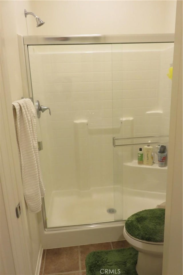24819 Onyx Dr, Menifee, CA 92585 - full bath with a shower stall, tile patterned flooring, and toilet