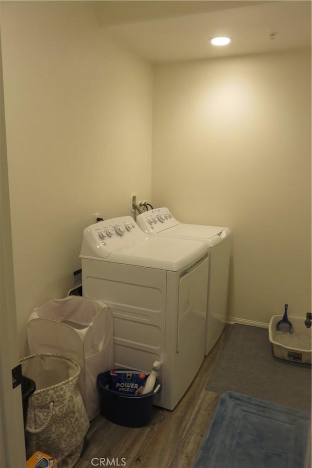 24819 Onyx Dr, Menifee, CA 92585 - laundry room featuring washing machine and clothes dryer, wood finished floors, recessed lighting, and baseboards
