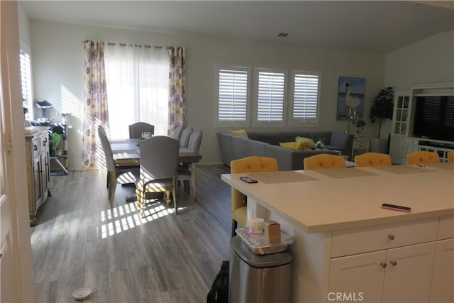 kitchen featuring white cabinetry and dark hardwood / wood-style flooring