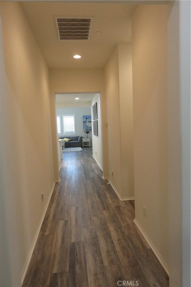 24819 Onyx Dr, Menifee, CA 92585 - hallway with dark wood-style flooring, recessed lighting, and baseboards