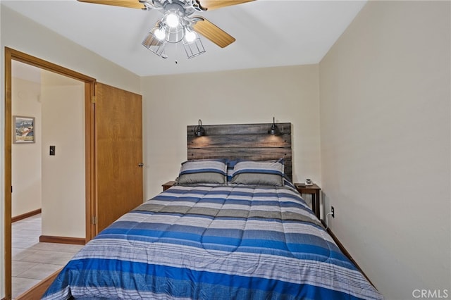 tiled bedroom with ceiling fan