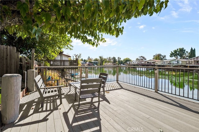 wooden terrace with a water view