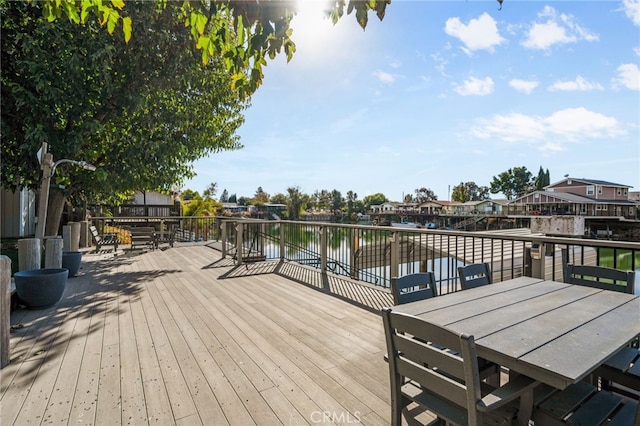 wooden deck with a water view