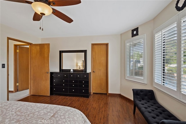 bedroom featuring dark hardwood / wood-style floors and ceiling fan