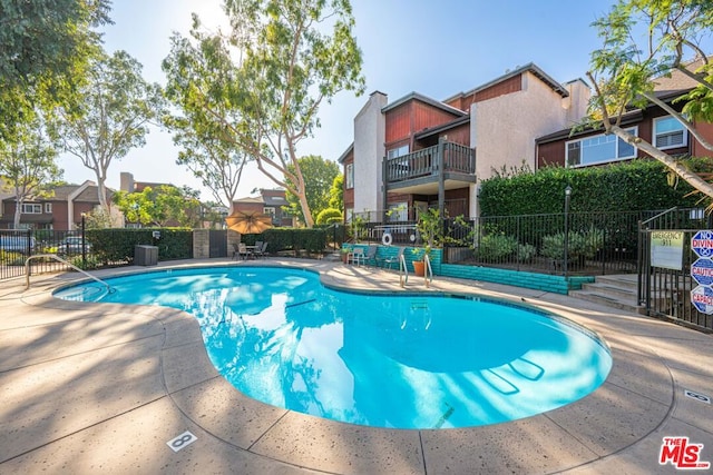 view of pool featuring a patio