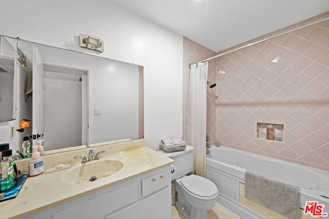 full bathroom featuring vanity, toilet, and shower / bath combo