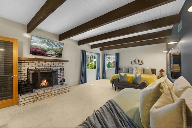 carpeted living room with beam ceiling and a brick fireplace