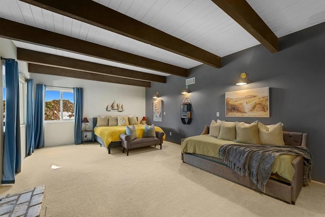 carpeted bedroom featuring beamed ceiling