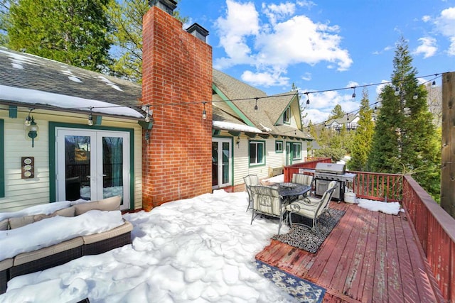 snow covered deck with area for grilling