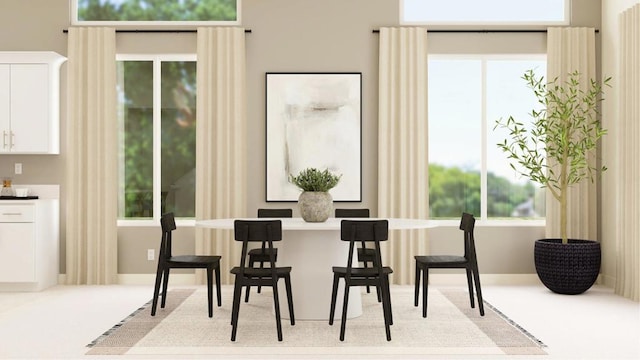 carpeted dining space featuring a wealth of natural light