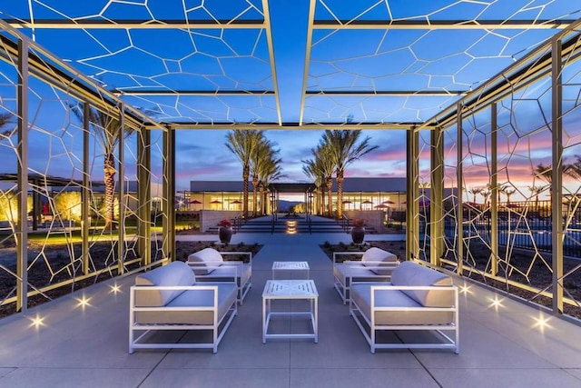 view of patio terrace at dusk