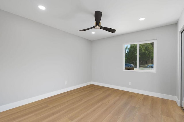 empty room featuring light hardwood / wood-style flooring and ceiling fan