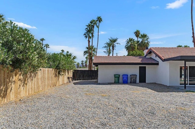 view of property exterior with a patio