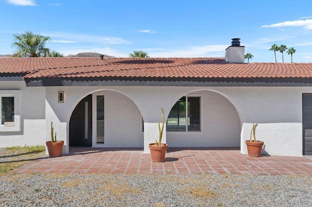 rear view of house with a patio