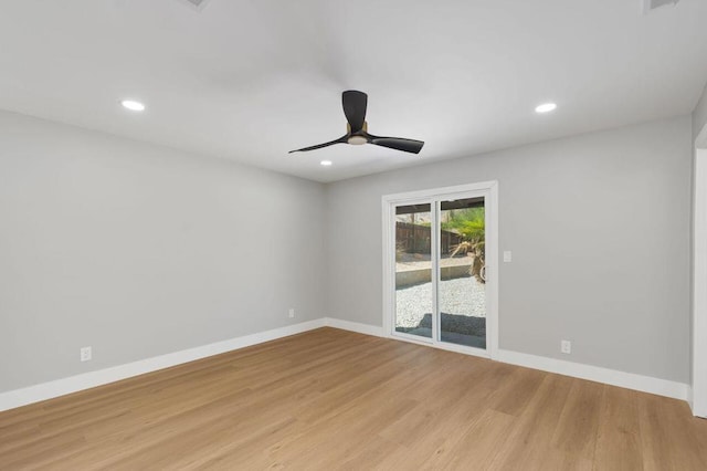 spare room featuring ceiling fan and light wood-type flooring