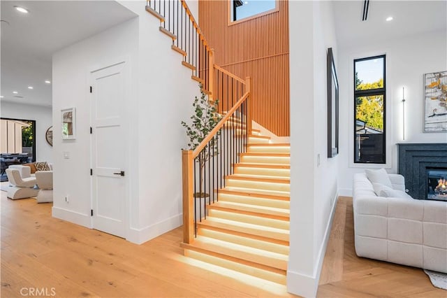 stairway featuring wood-type flooring