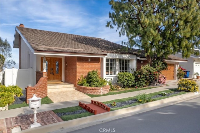 ranch-style home with a garage