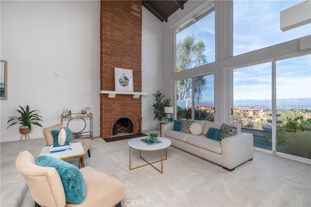 living room featuring a brick fireplace and high vaulted ceiling