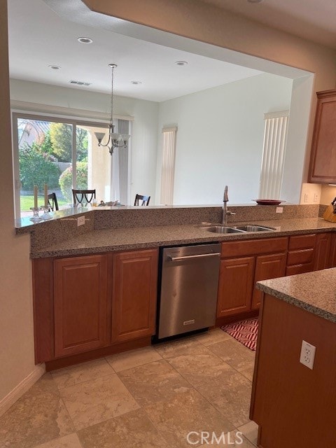 kitchen featuring sink, dishwasher, pendant lighting, and an inviting chandelier