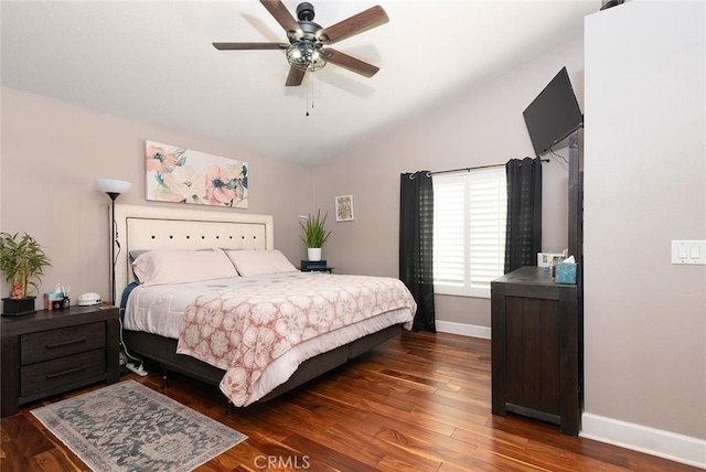 bedroom with dark hardwood / wood-style floors, ceiling fan, and lofted ceiling