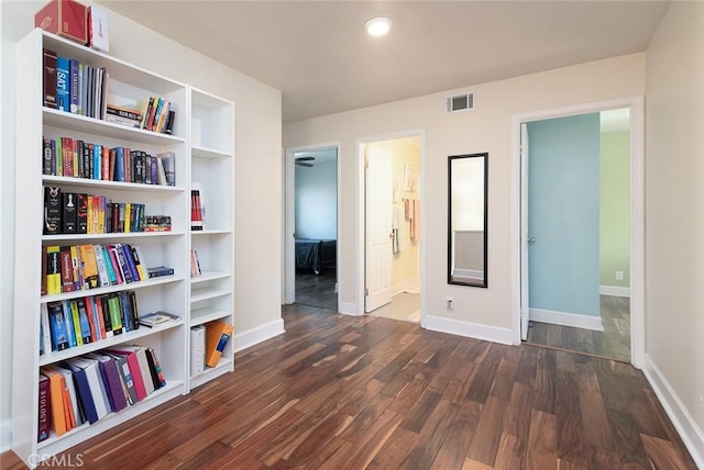 interior space with ensuite bathroom and dark hardwood / wood-style flooring