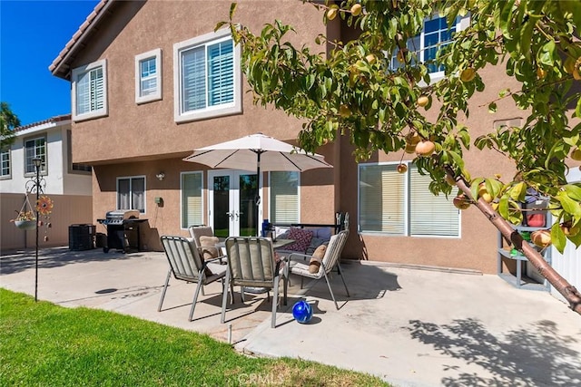 back of house with french doors and a patio