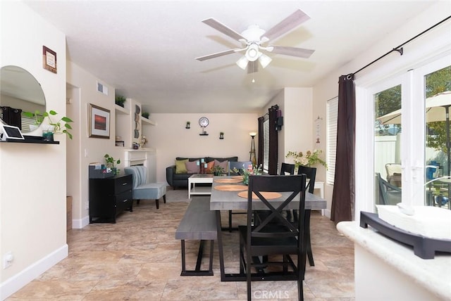 dining space with ceiling fan