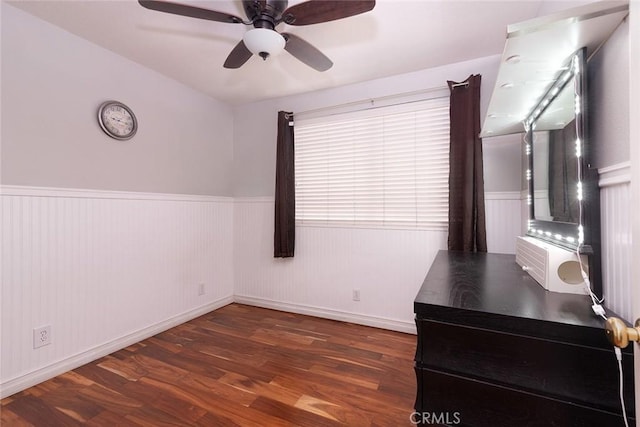 interior space featuring ceiling fan and dark wood-type flooring