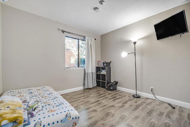 bedroom featuring hardwood / wood-style floors