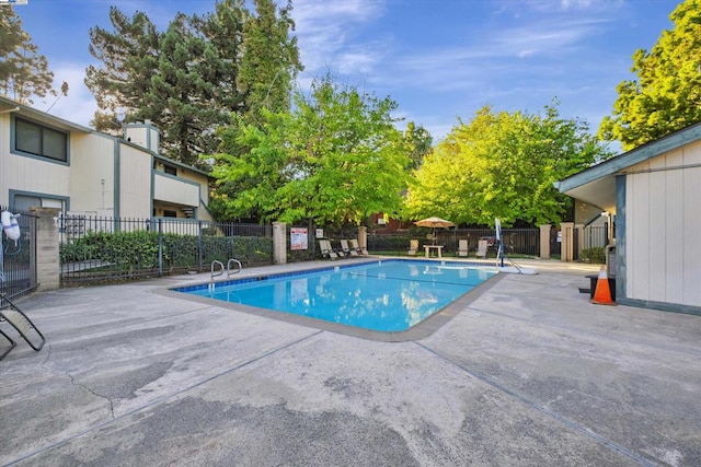 view of pool featuring a patio