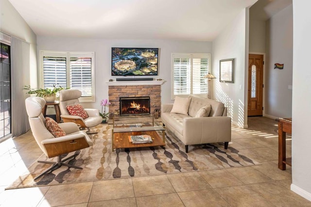 tiled living room featuring vaulted ceiling and a fireplace