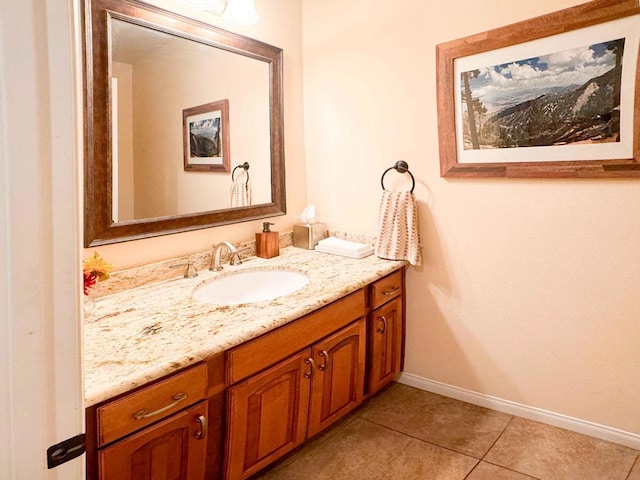 bathroom featuring tile patterned flooring and vanity