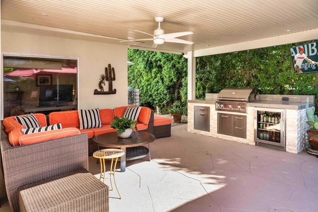 view of patio / terrace featuring exterior kitchen, outdoor lounge area, ceiling fan, and area for grilling