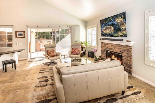 tiled living room featuring vaulted ceiling and a fireplace