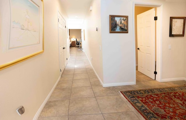 corridor with light tile patterned floors