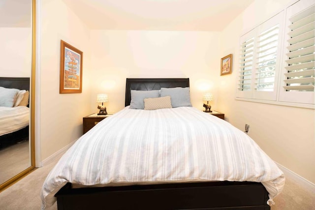 carpeted bedroom featuring a closet