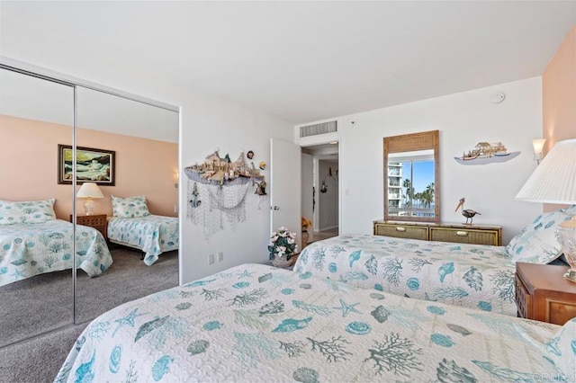 carpeted bedroom with a closet