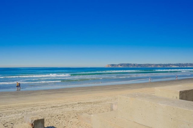 view of water feature with a beach view