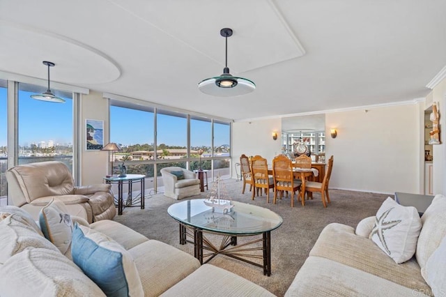 carpeted living room featuring crown molding and floor to ceiling windows