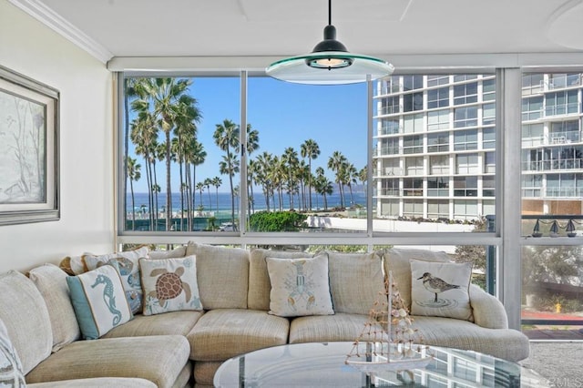 sunroom / solarium featuring a water view