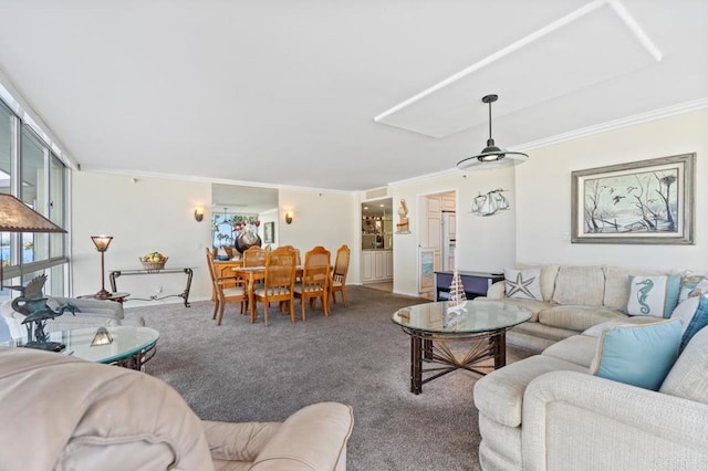 living room featuring crown molding and carpet