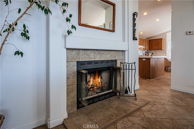 room details featuring a tile fireplace