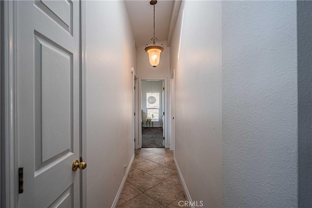 hallway featuring light tile patterned floors