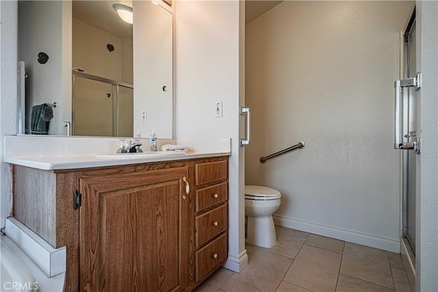 bathroom featuring toilet, vanity, tile patterned floors, and walk in shower