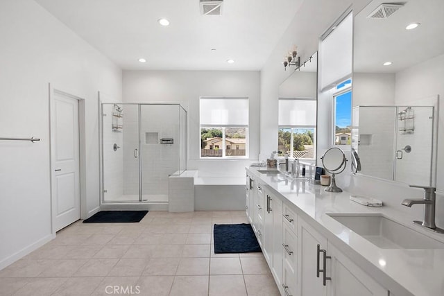 bathroom featuring tile patterned floors, vanity, and separate shower and tub