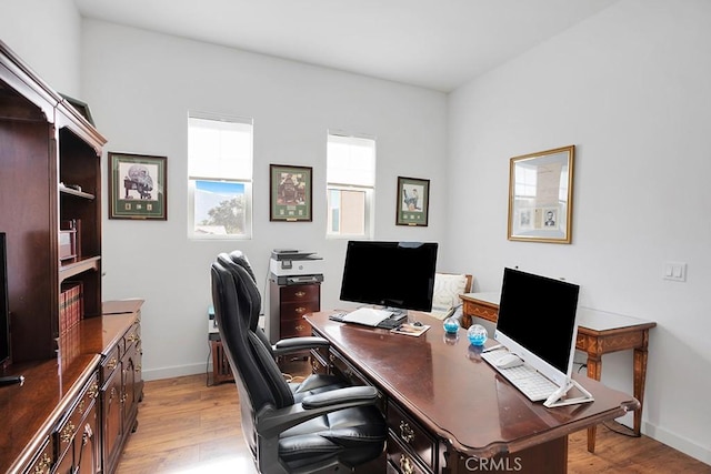 home office featuring light hardwood / wood-style floors