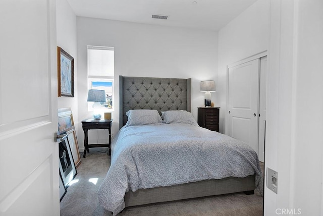 carpeted bedroom with a closet