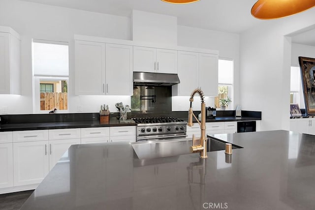 kitchen with wine cooler, white cabinets, dark wood-type flooring, and high end stainless steel range oven