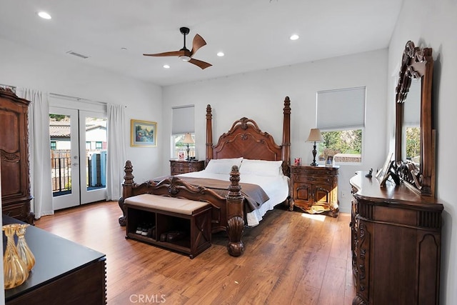 bedroom featuring access to outside, ceiling fan, french doors, and wood-type flooring