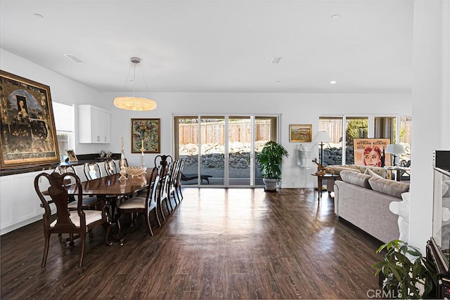 dining room with dark wood-type flooring